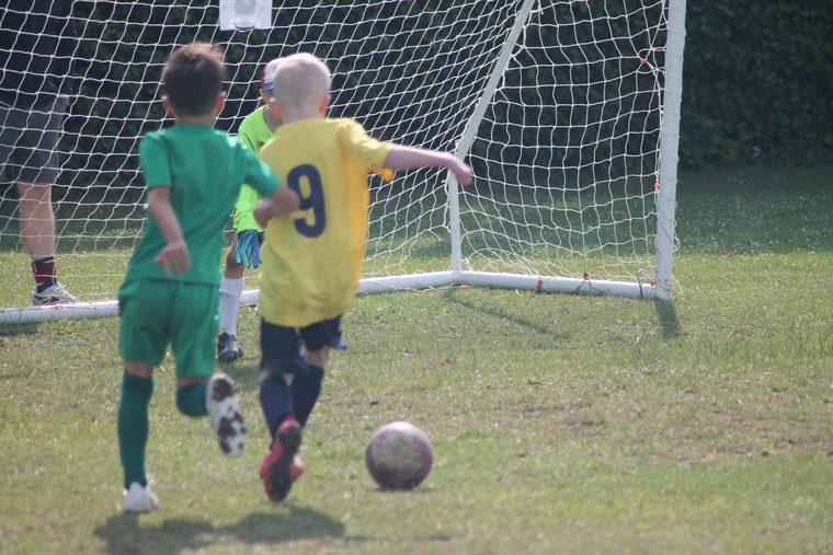 A Southside Star player running onto the ball towards goal