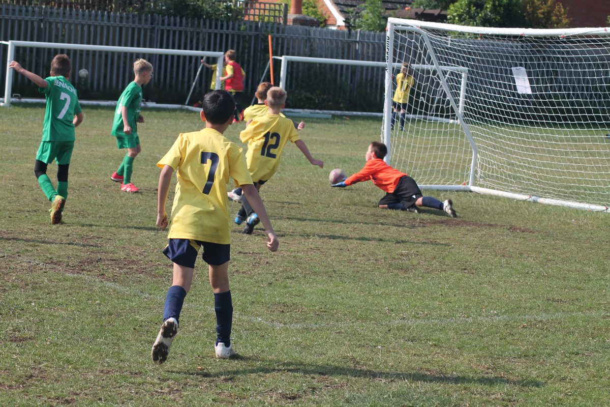 A young Southside Star goalkeeper making a diving save