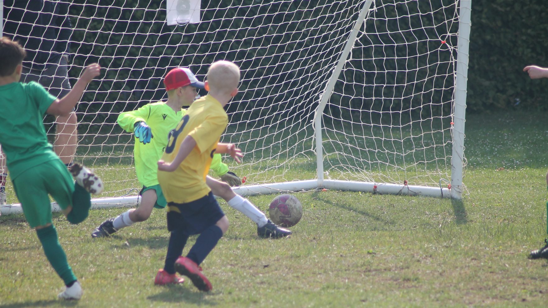 Southside Star Youth FC players in a goalmouth scramble during a match