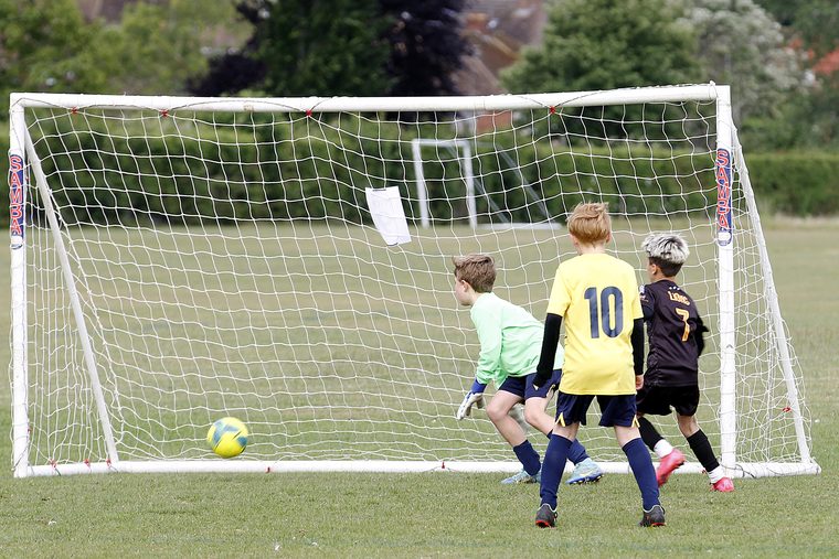 Southside Star players scrambling for the ball in the goalmouth
