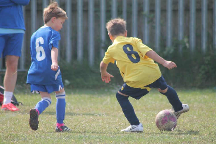 A Southside Star player shielding the ball from an opponent