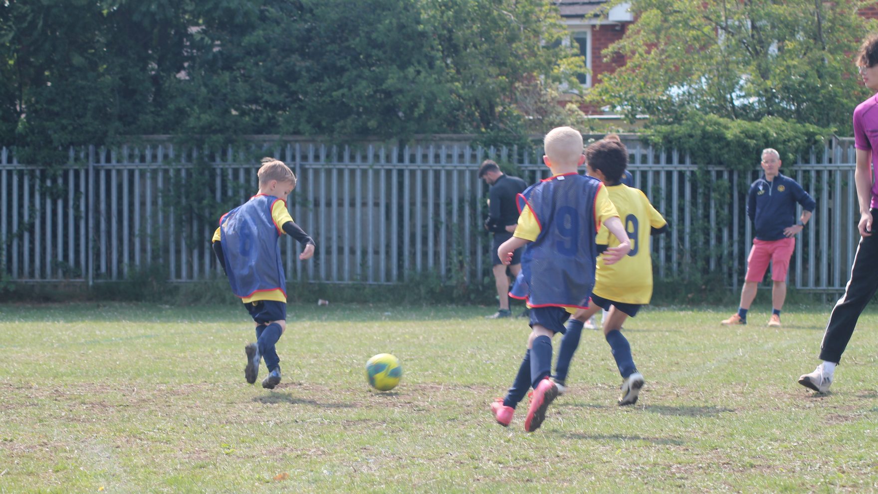 Young Southside Star Youth FC players in yellow kit on a match day